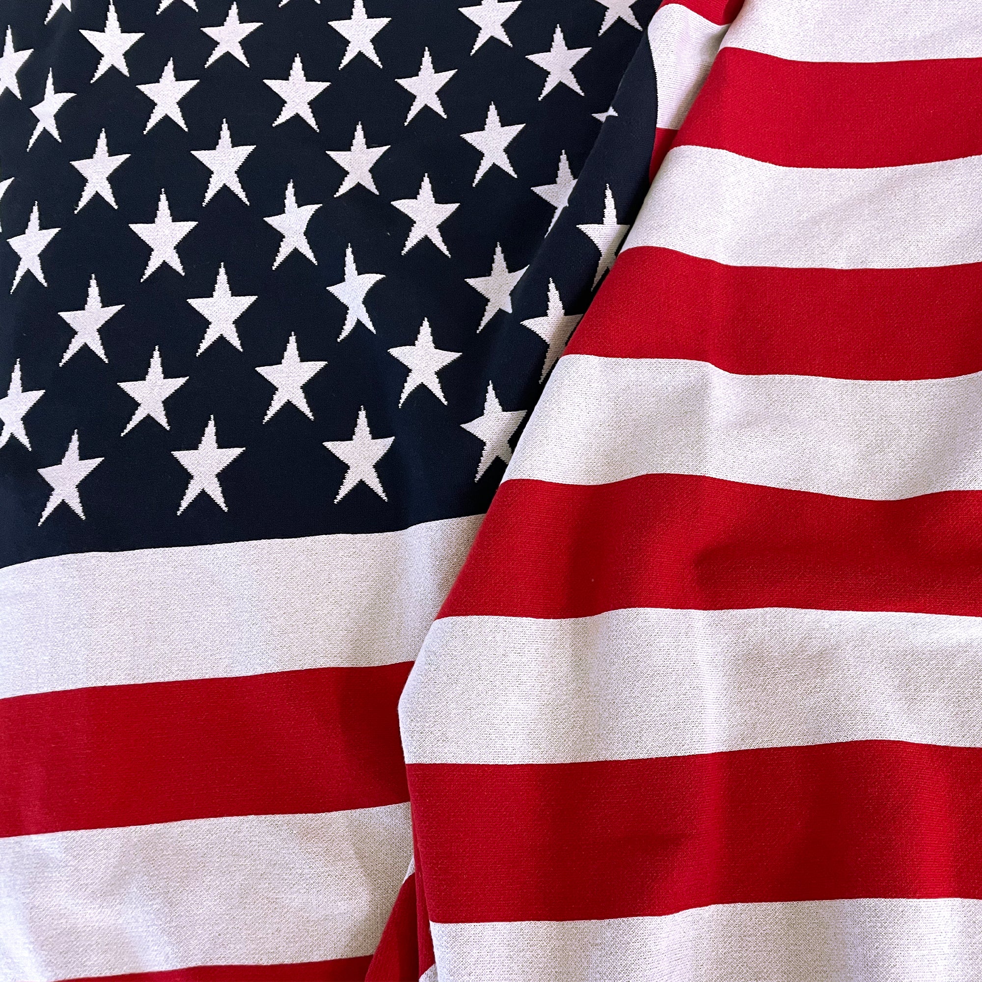 AMERICAN BLANKET COMPANY - KNITTED FLAG BLANKETS - Close up of the knitted and textured fabric. 50% Cotton 50% polyester