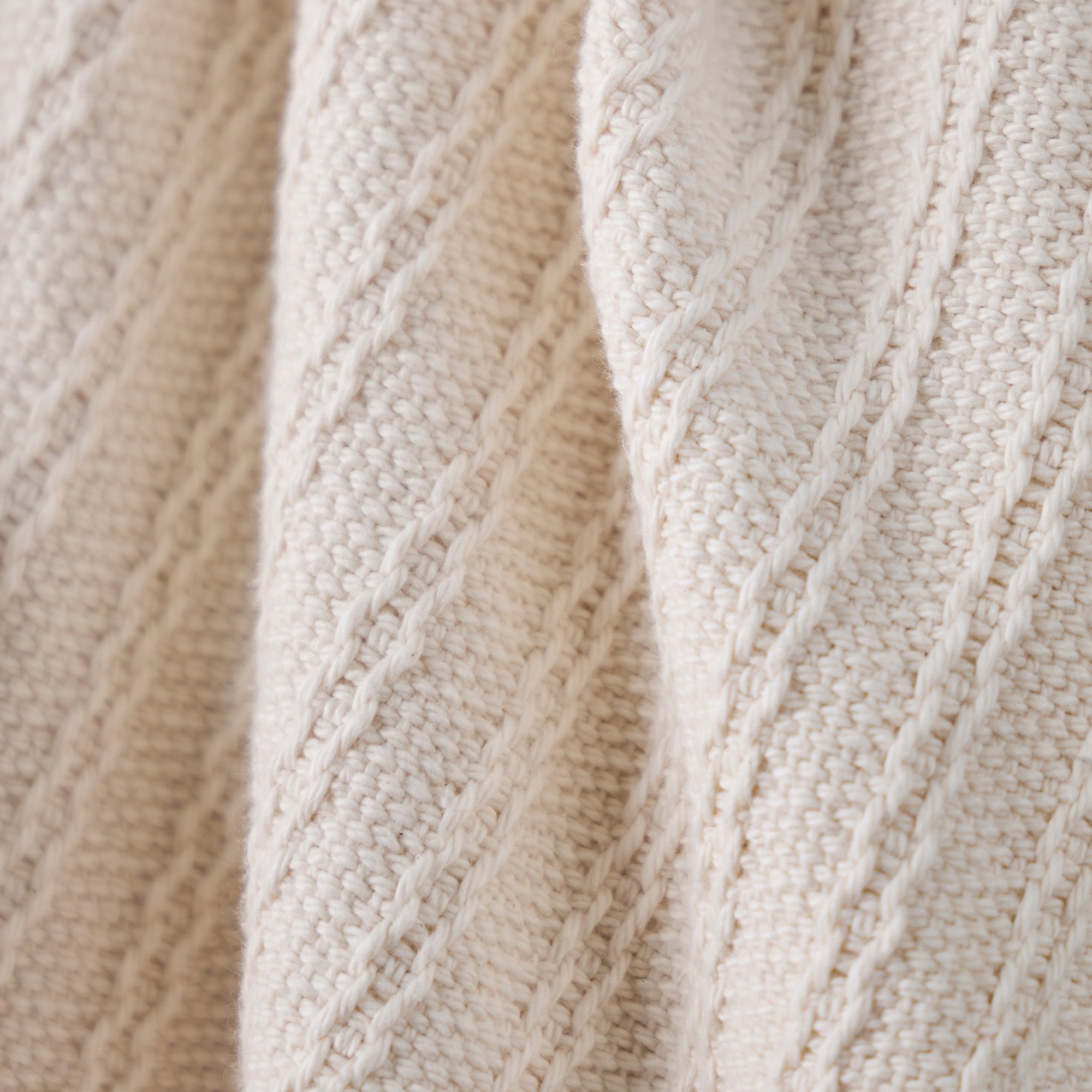 American Blanket Company - Oversized Cable weave 100% Cotton Blanket -  Cable Weave Cotton Blanket - Close-up of beige woven 100% cotton blanket with cable pattern