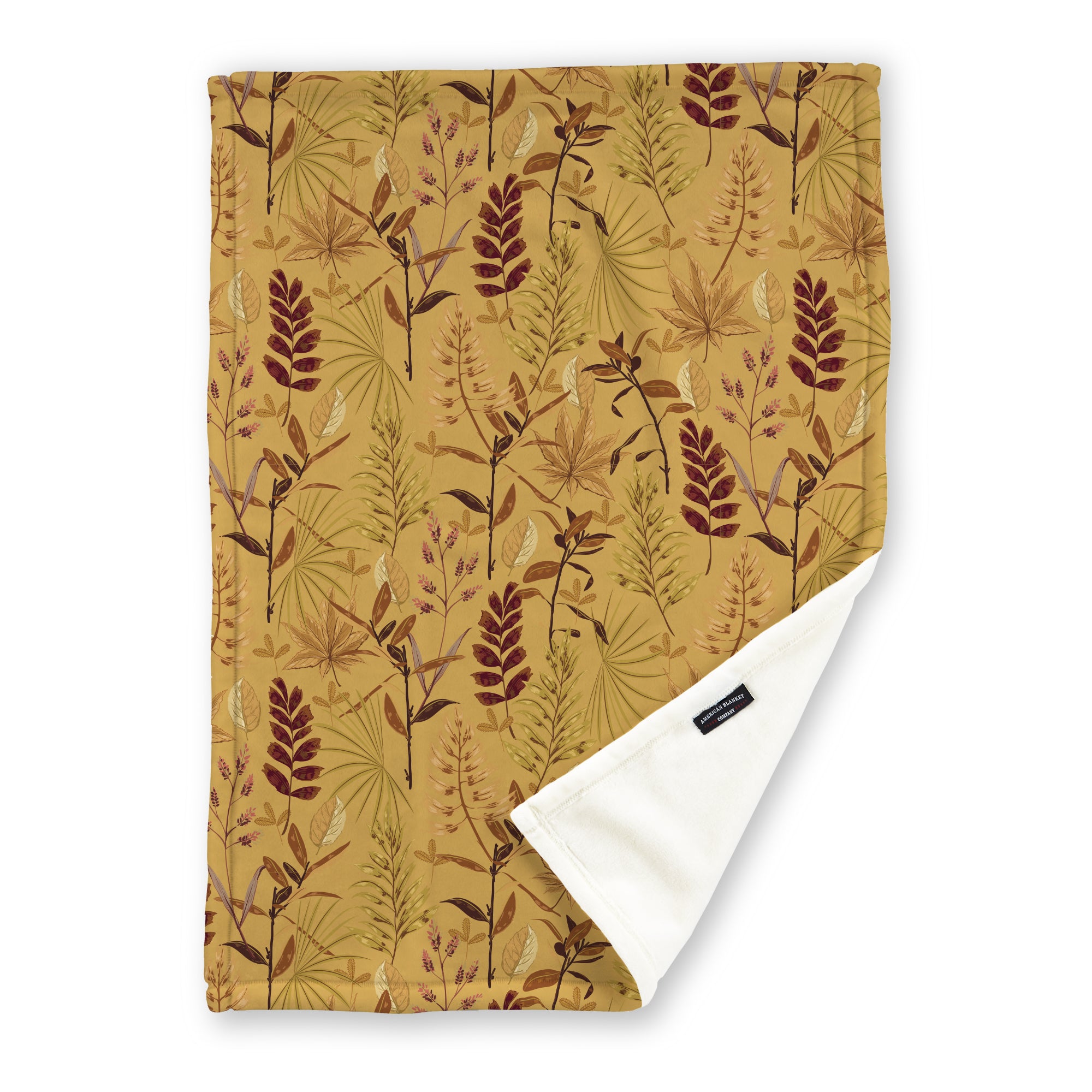 American Blanket Company - Luster Loft Fleece Blanket - Printed Fall Patterned Throw Blanket - A fleece throw blanket with a fall-themed printed pattern on a beige background, folded to show the reverse side.