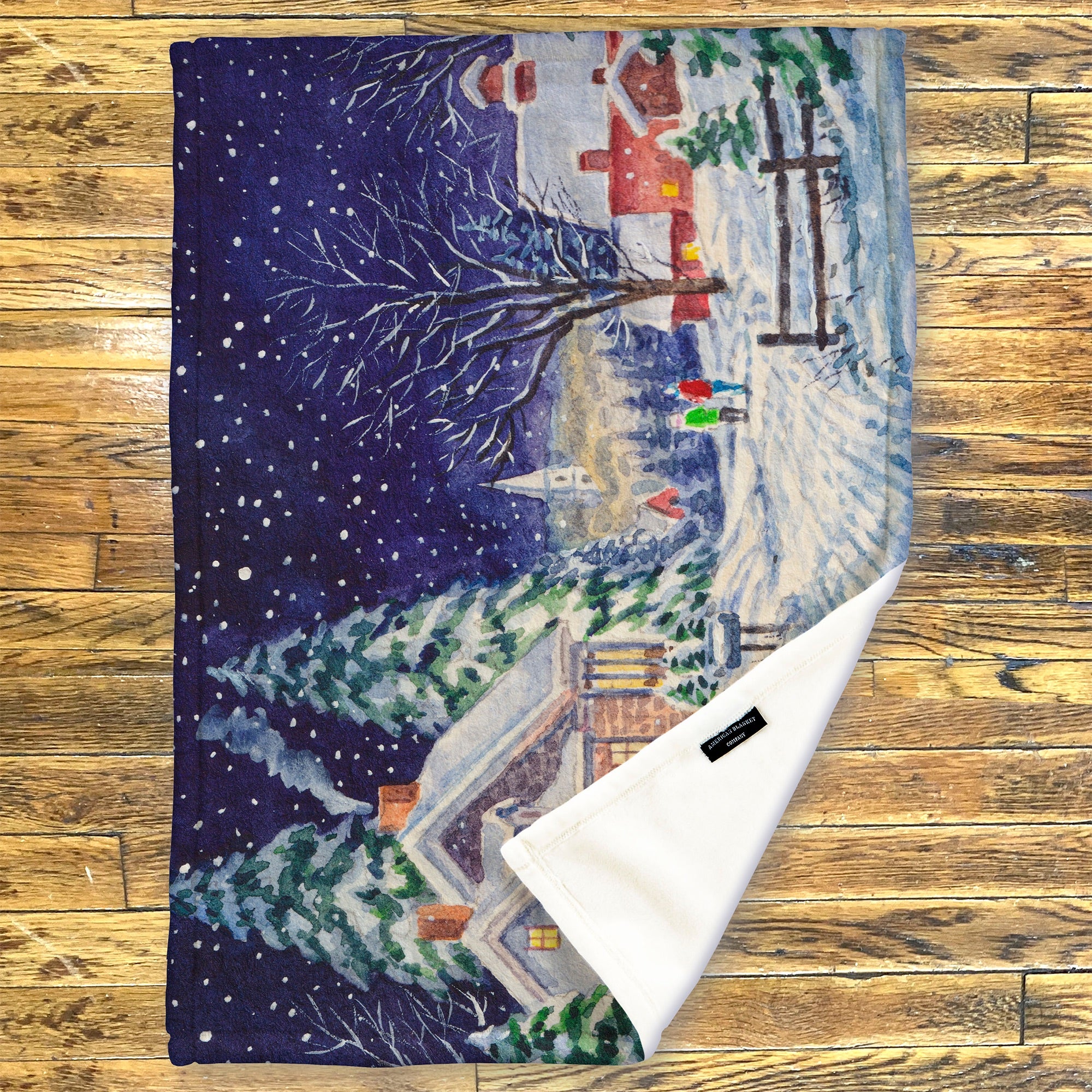 American Blanket Company - Luster Loft Fleece Blanket - Printed Holiday Throw Blanket - Fleece blanket with winter scene design on a wooden surface