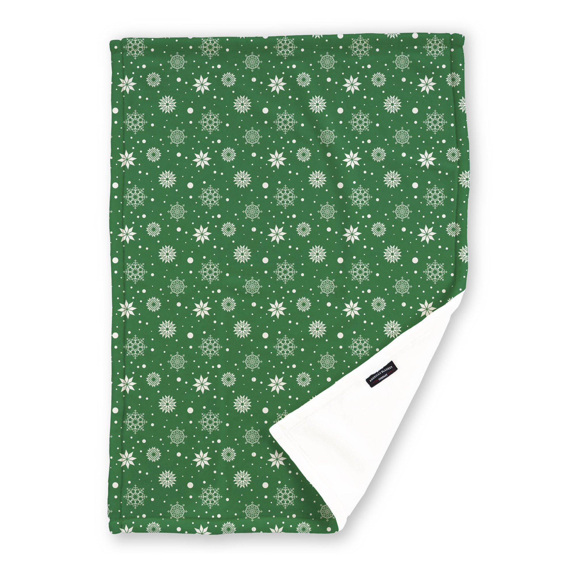 American Blanket Company - Luster Loft Fleece Blanket - Printed Holiday Patterned Throw Blanket - A green throw blanket featuring white snowflakes