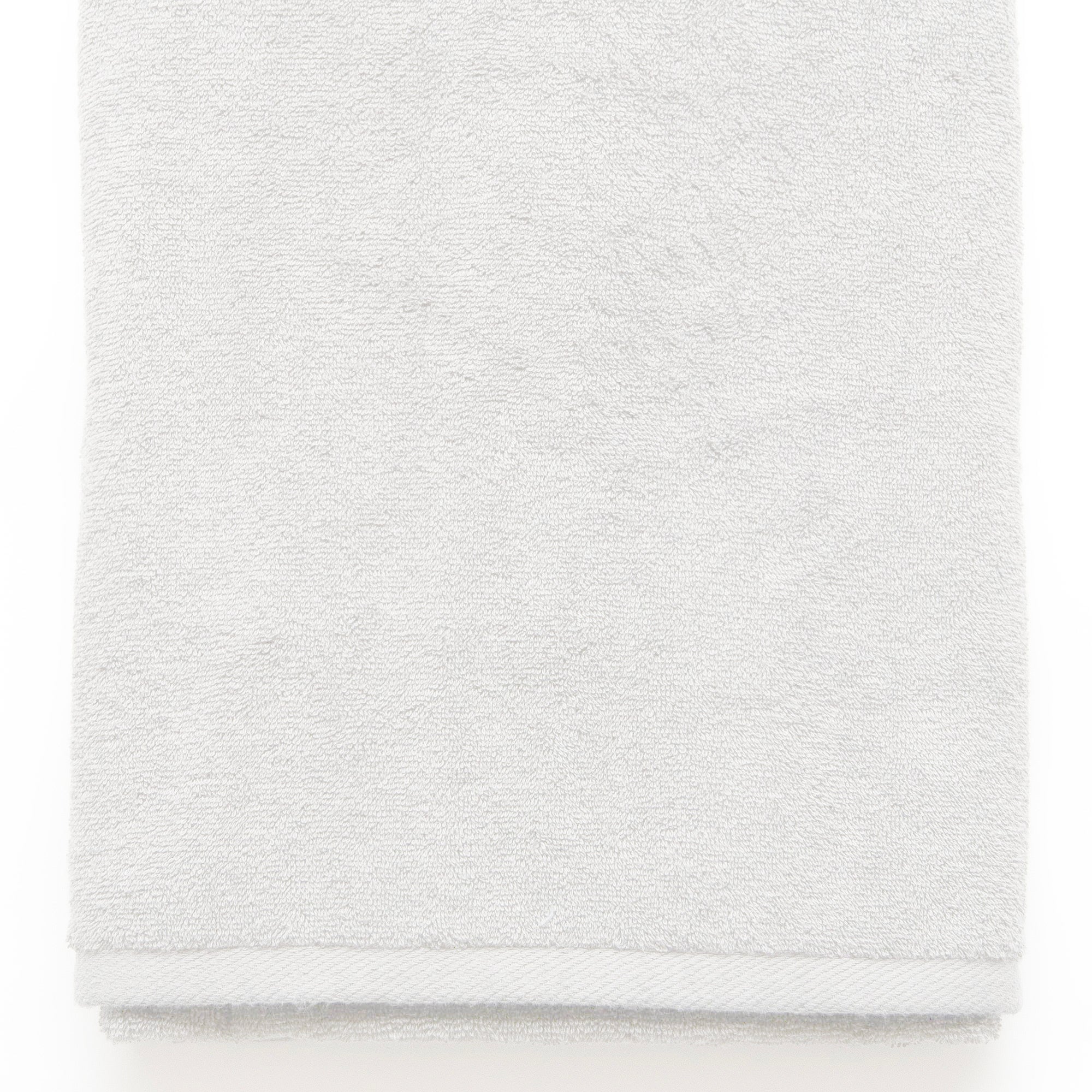 American Blanket Company -  Colorful Made in the USA 100% Cotton towels - Folded white towel on a white background