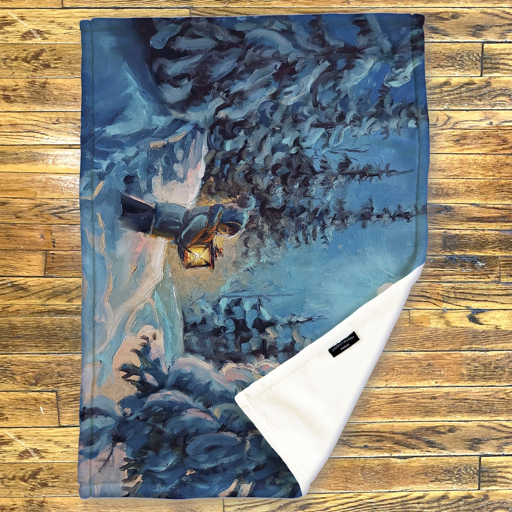 American Blanket Company - Luster Loft Fleece Blanket - Printed Holiday Throw Blanket - Fleece blanket with winter scene design on a wooden surface