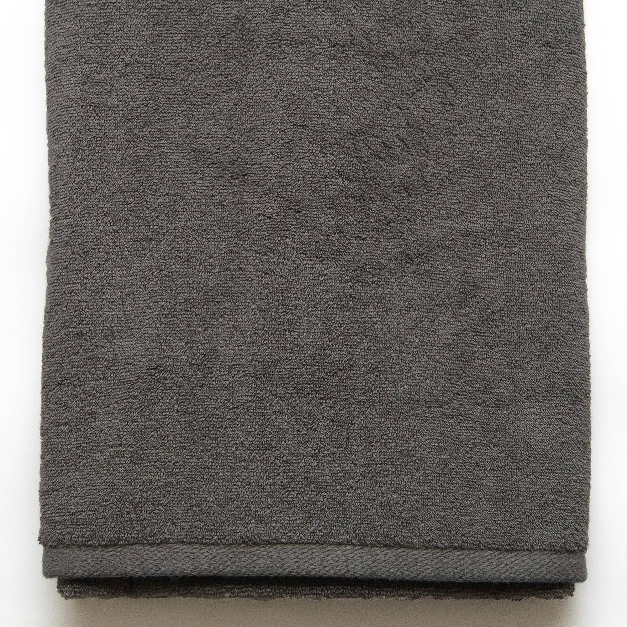 American Blanket Company -  Colorful Made in the USA 100% Cotton towels - Folded gray towel on a white background