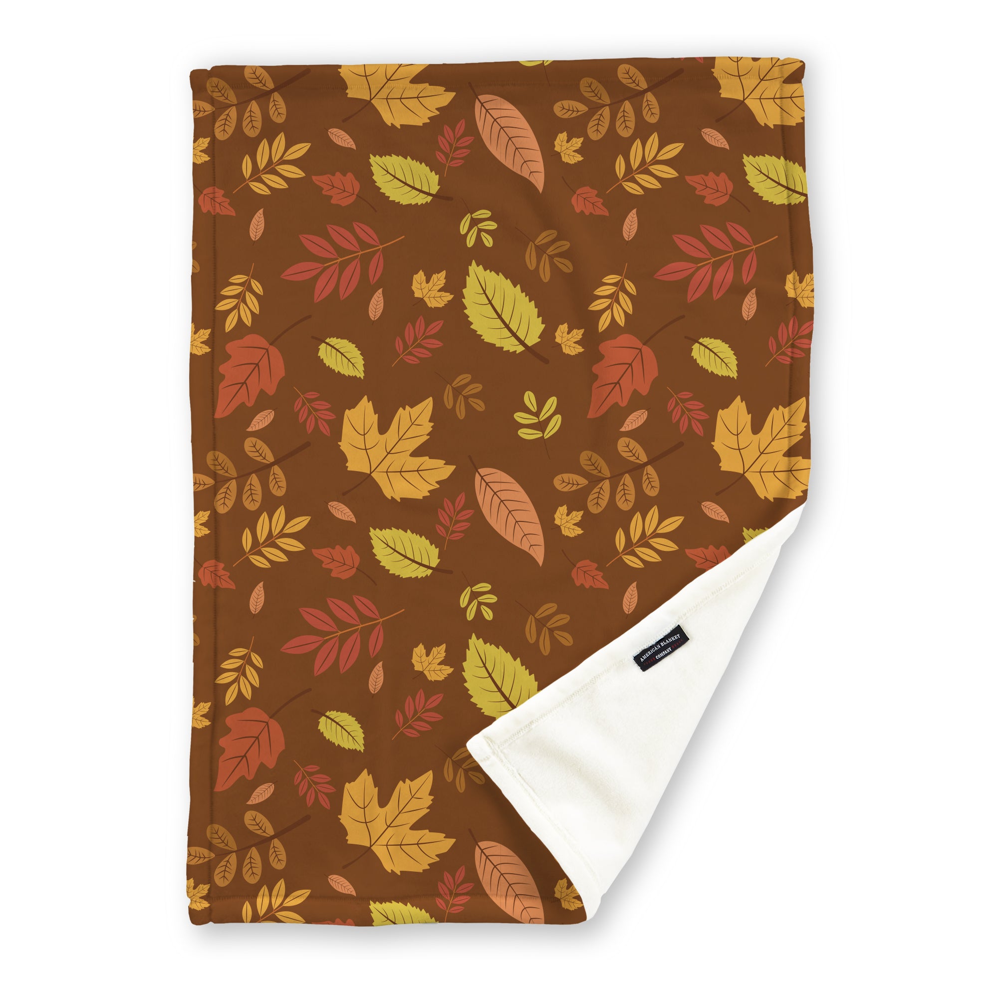 American Blanket Company - Luster Loft Fleece Blanket - Printed Fall Patterned Throw Blanket - A fleece throw blanket with a fall-themed printed pattern on a Brown background with leaves, folded to show the reverse side.