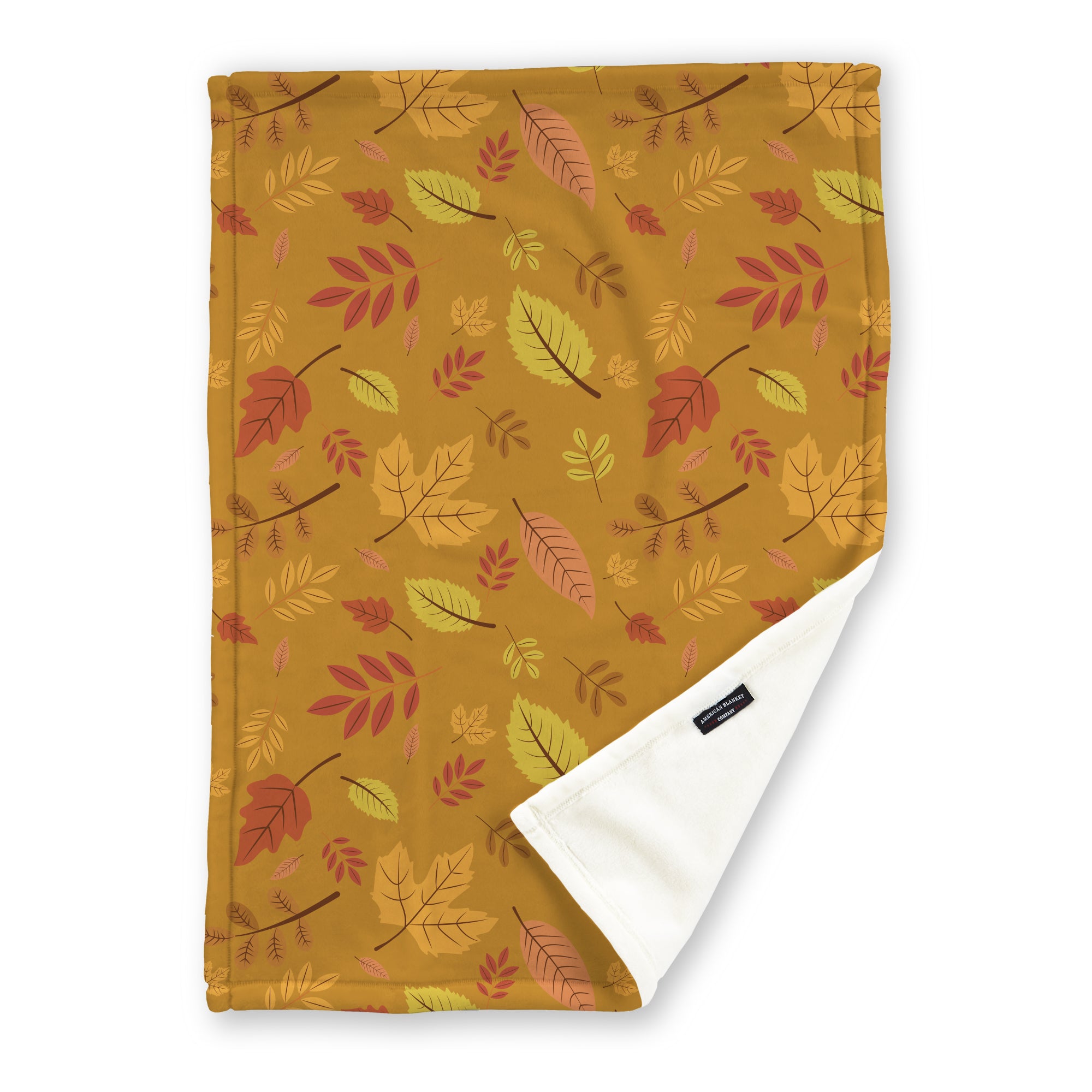 American Blanket Company - Luster Loft Fleece Blanket - Printed Fall Patterned Throw Blanket - A fleece throw blanket with a fall-themed printed pattern on a golden background with leaves, folded to show the reverse side.