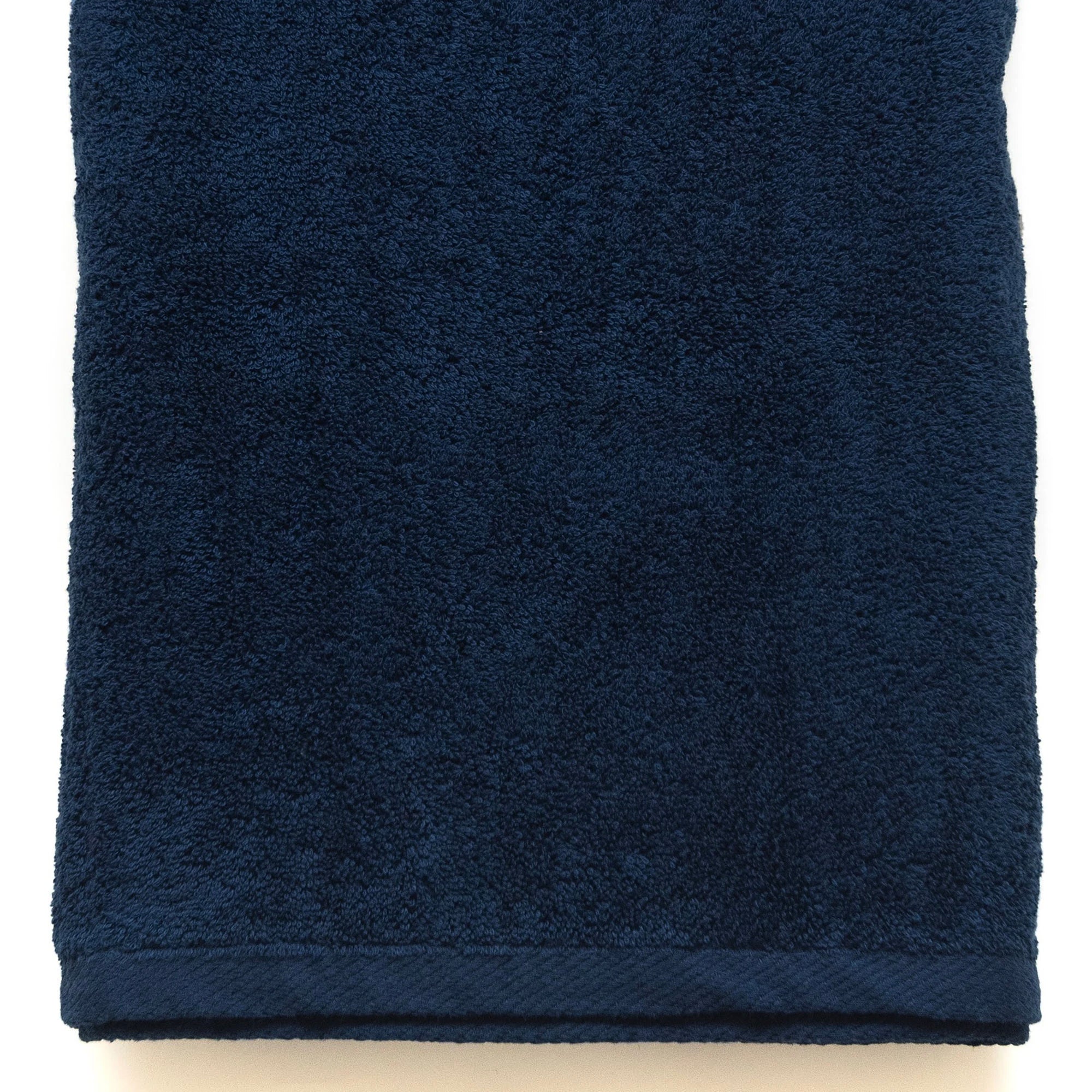 American Blanket Company -  Colorful Made in the USA 100% Cotton towels - Folded navy towel on a white background