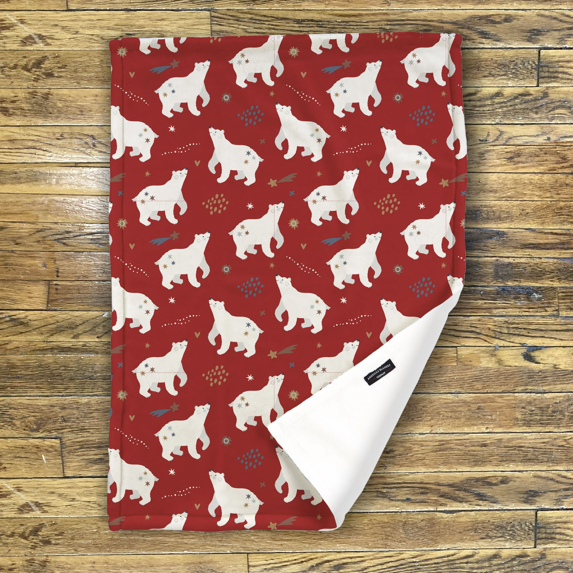 American Blanket Company - Luster Loft Fleece Blanket - Printed Holiday Patterned Throw Blanket - Fleece blanket red with white bear pattern on a wooden surface