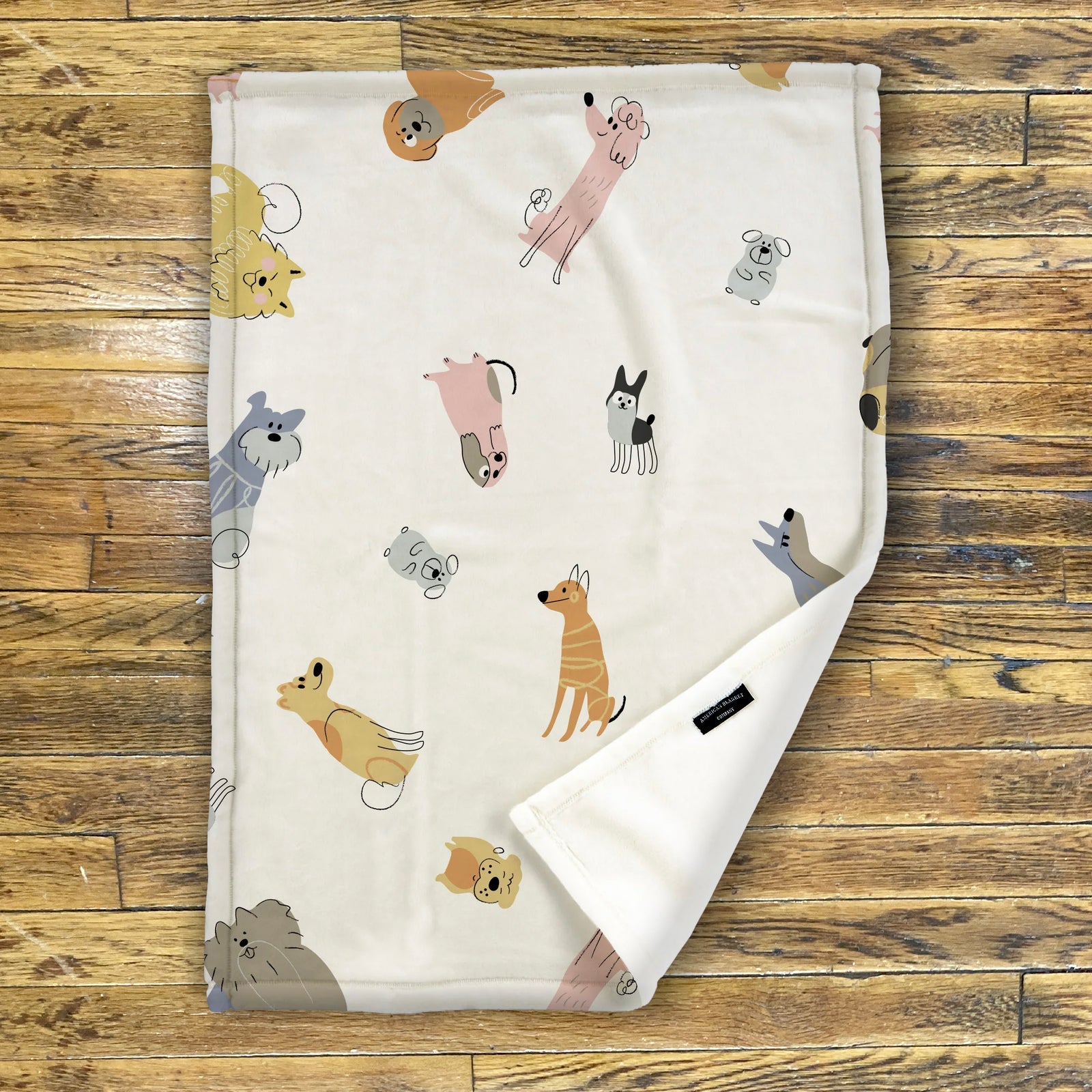 American Blanket Company - Luster Loft Fleece Blankets - Printed Fleece Baby Blankets -A printed fleece baby blanket with various cartoon dogs displayed across the fabric.