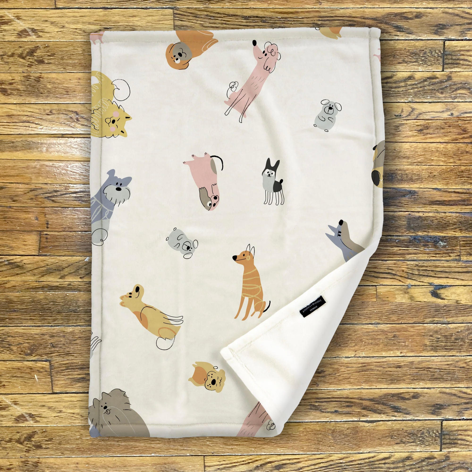 American Blanket Company - Luster Loft Fleece Blankets - Printed Fleece Baby Blankets -A printed fleece baby blanket with various cartoon dogs displayed across the fabric.