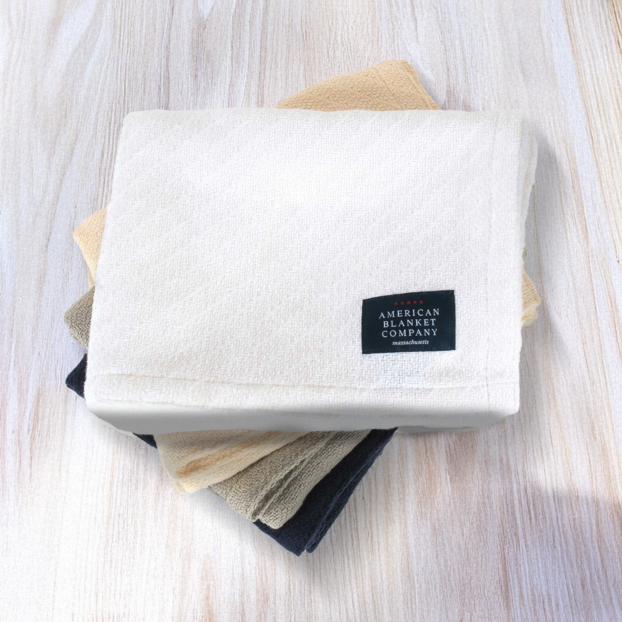 American Blanket Company - 100% Cotton Baby Blankets - Stack of cotton baby blankets white-natural-gray-navy
