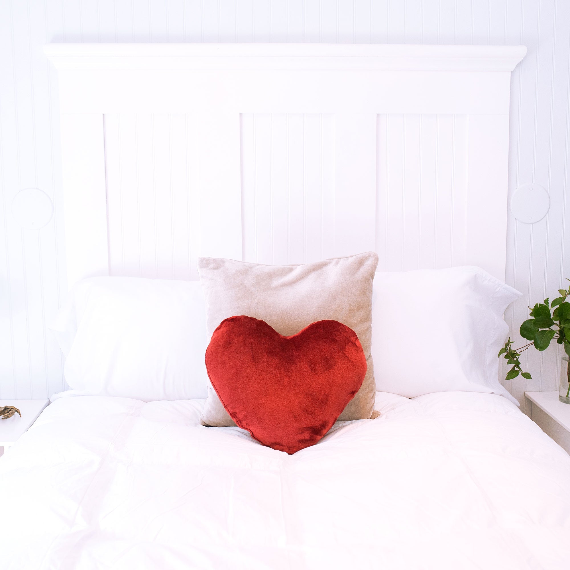 American Blanket Company - luster loft fleece heart pillows - luster loft fleece throw pillow on white bed