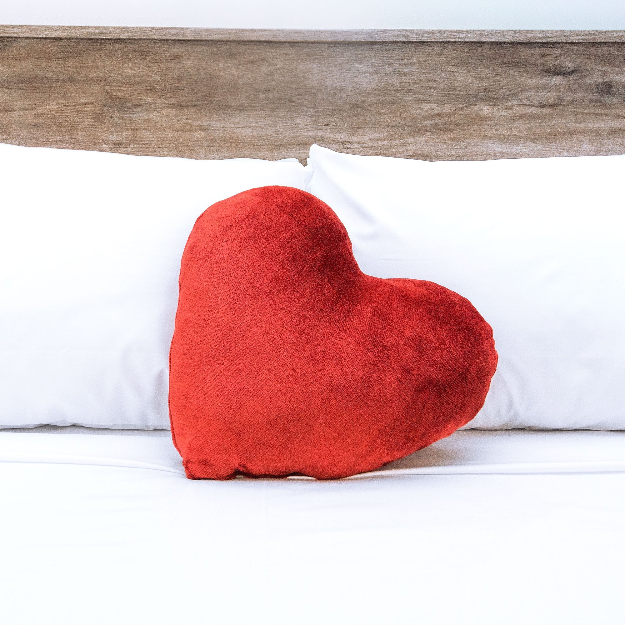 American Blanket Company - luster loft fleece heart pillows - red heart pillow fleece heart pillow on bed 