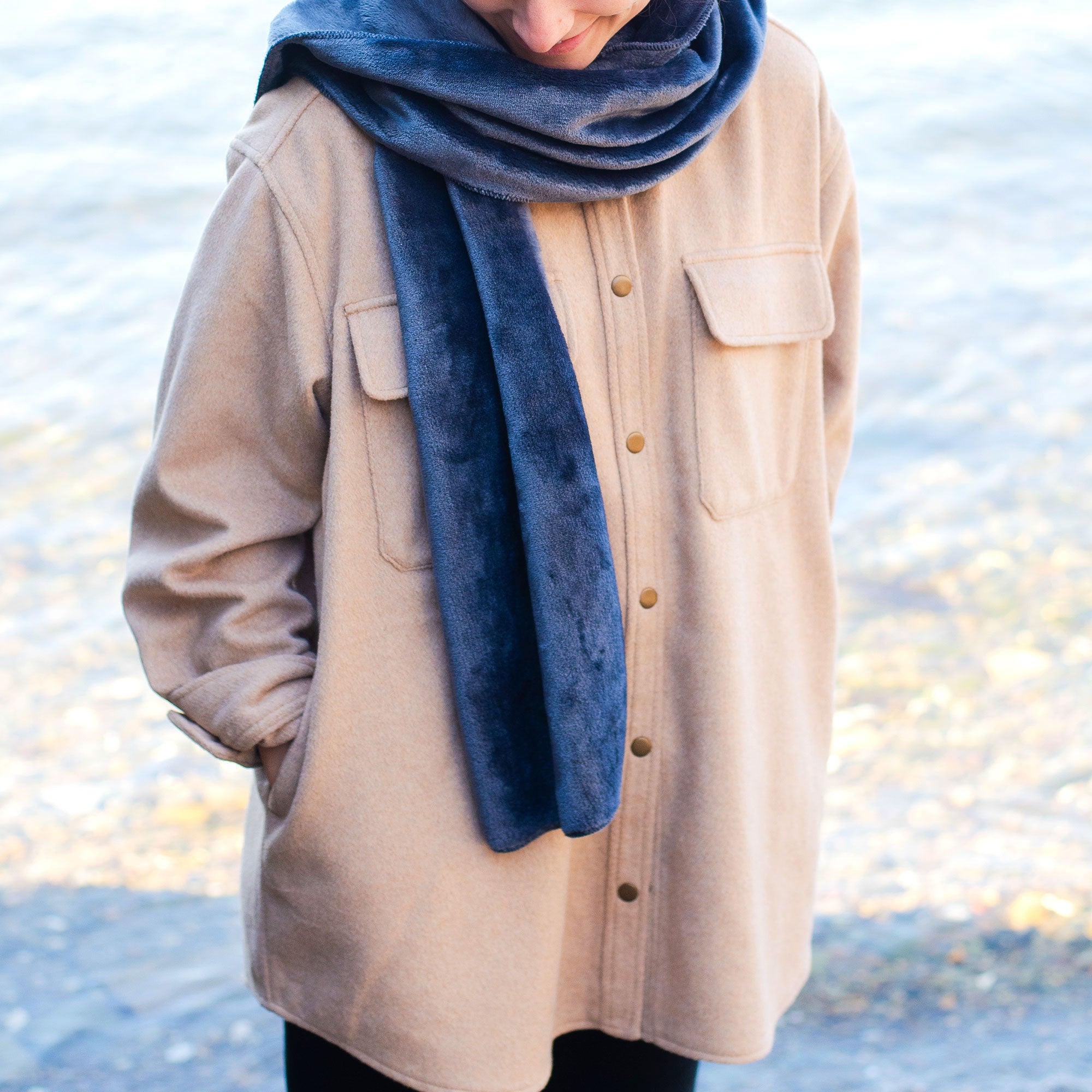 American Blanket Company - Luster Loft Fleece Scarf - Young woman wearing luster loft fleece scarf  in front of snowy ground.