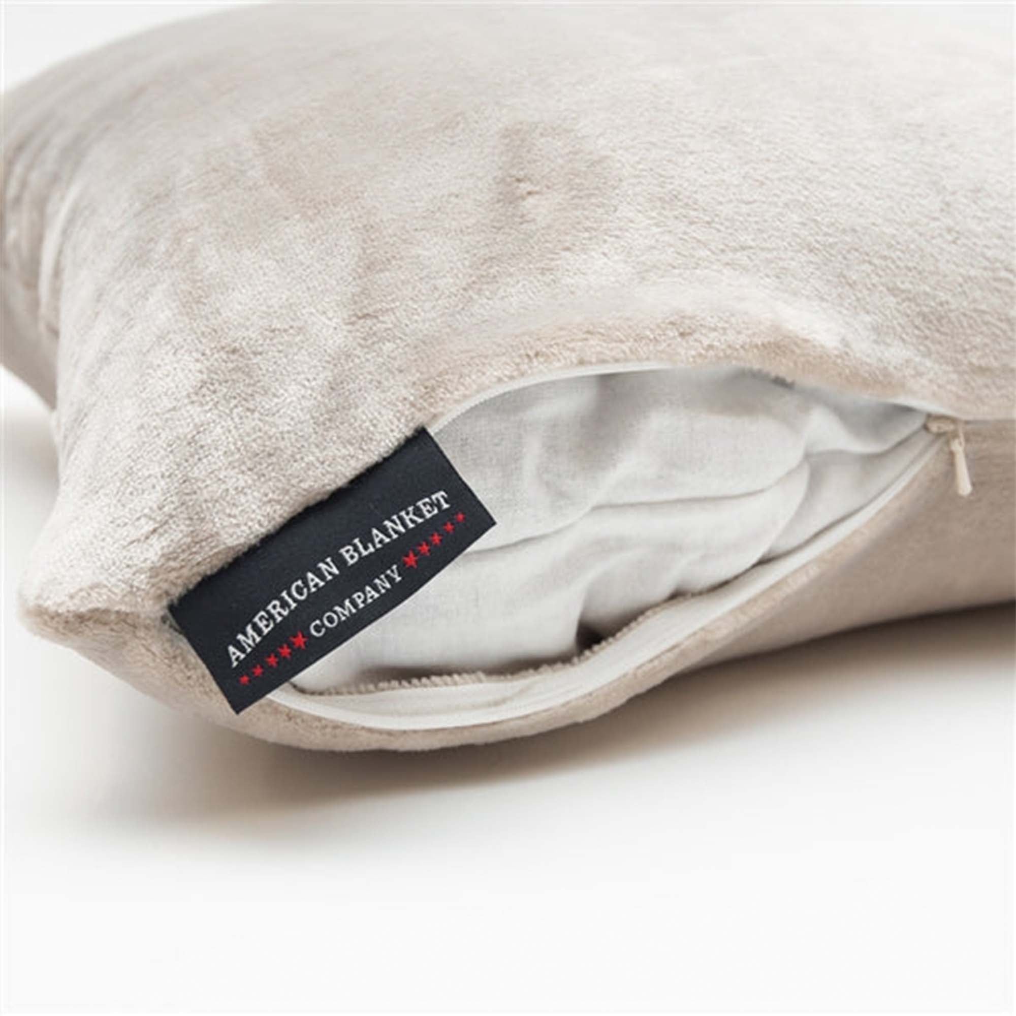American Blanket Company -  luster loft fleece throw pillows - Luster Loft Fleece throw pillow zipper detail show showing company logo tag 
