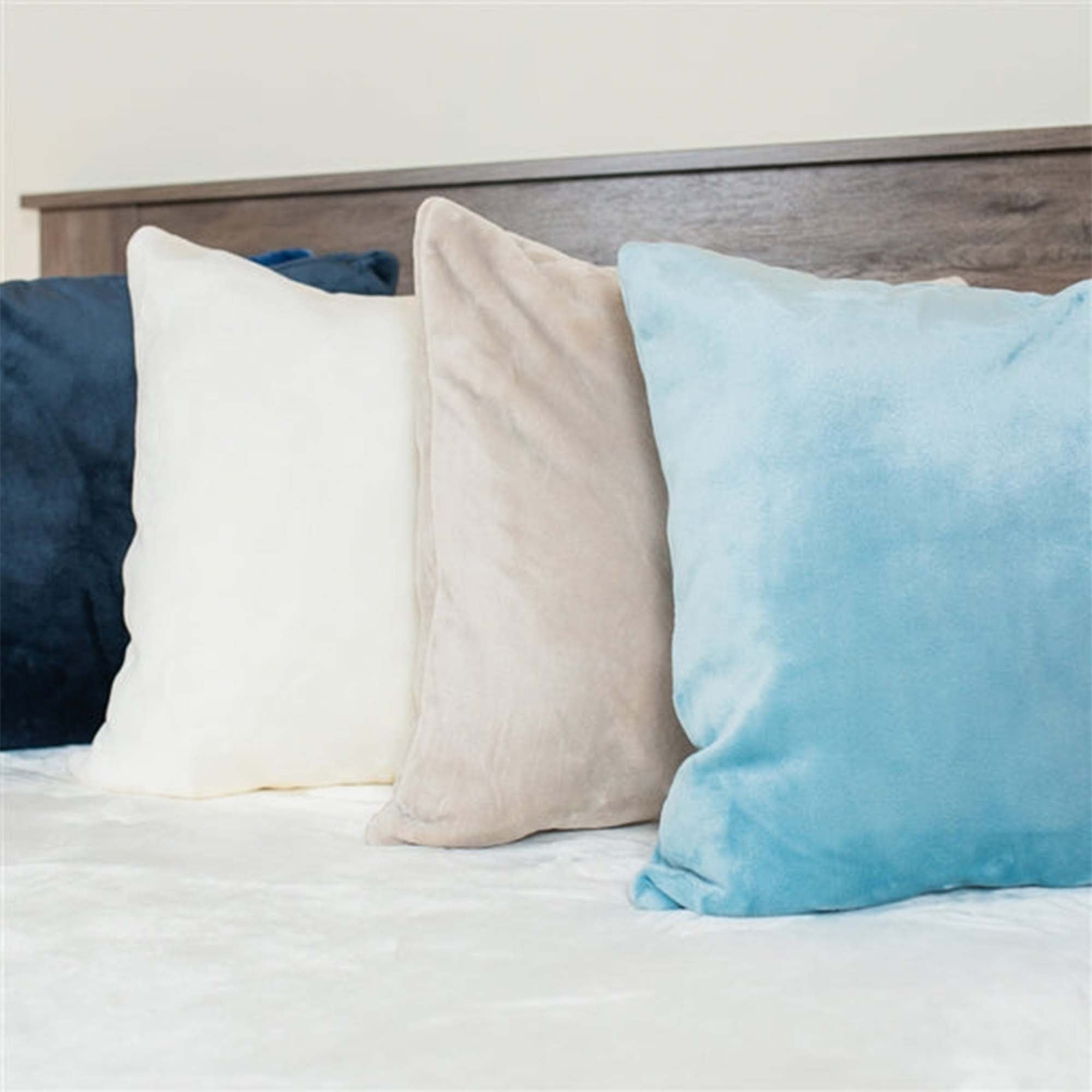 American Blanket Company -  luster loft fleece throw pillows - Assorted Luster Loft Fleece Throw Pillows On Bed