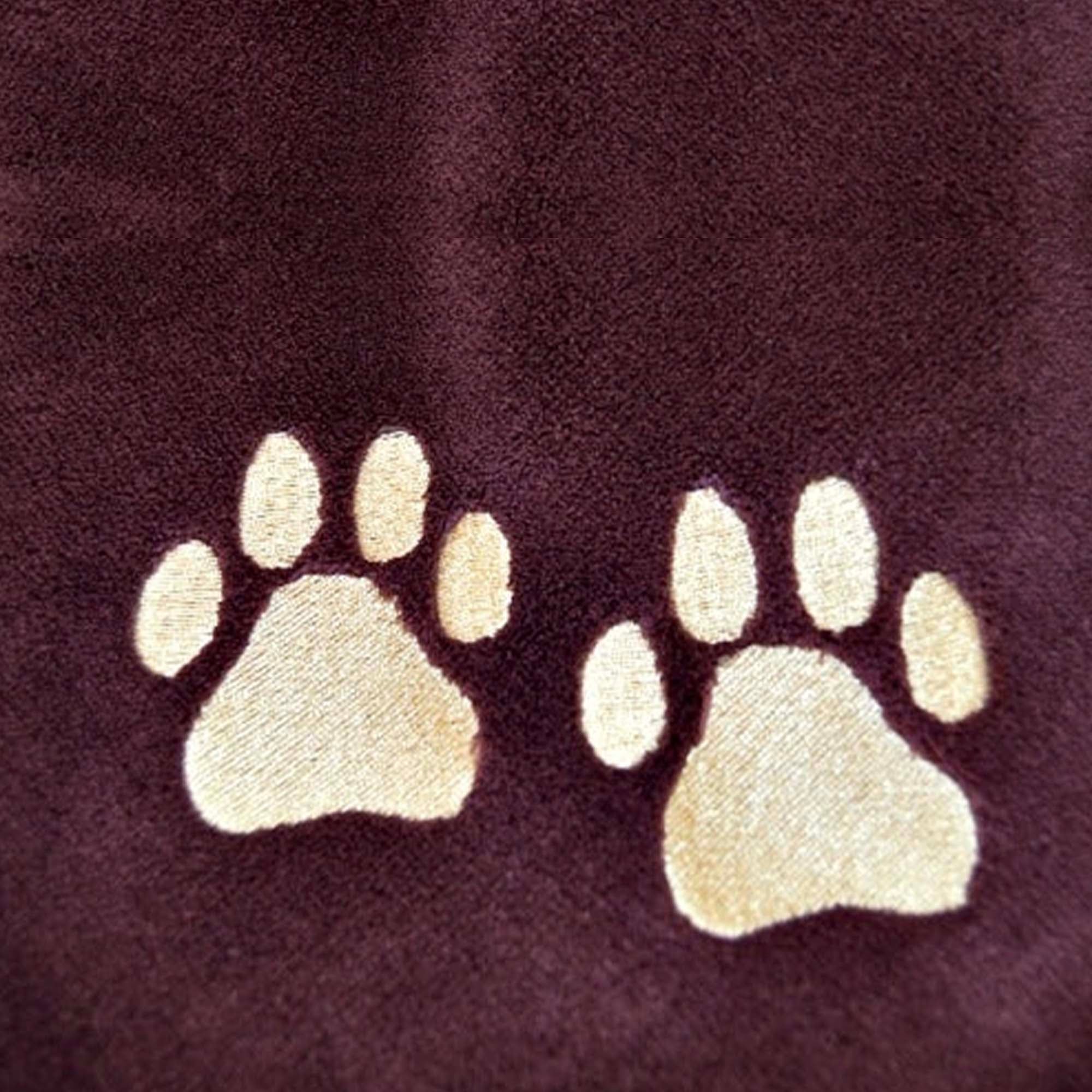 AMERICAN BLANKET COMPANY - Luster Loft fleece blankets - Pet Fleece Blankets - paw print embroidery on a red luster loft fleece blanket.