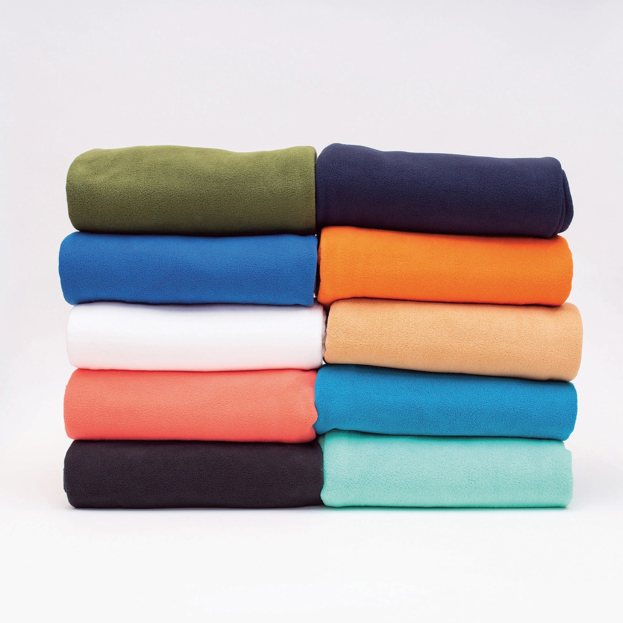 American Blanket Company - Peaceful Touch Fleece Blankets - Stacks of Peaceful Touch Blankets in the full color range from black to white and every color in between