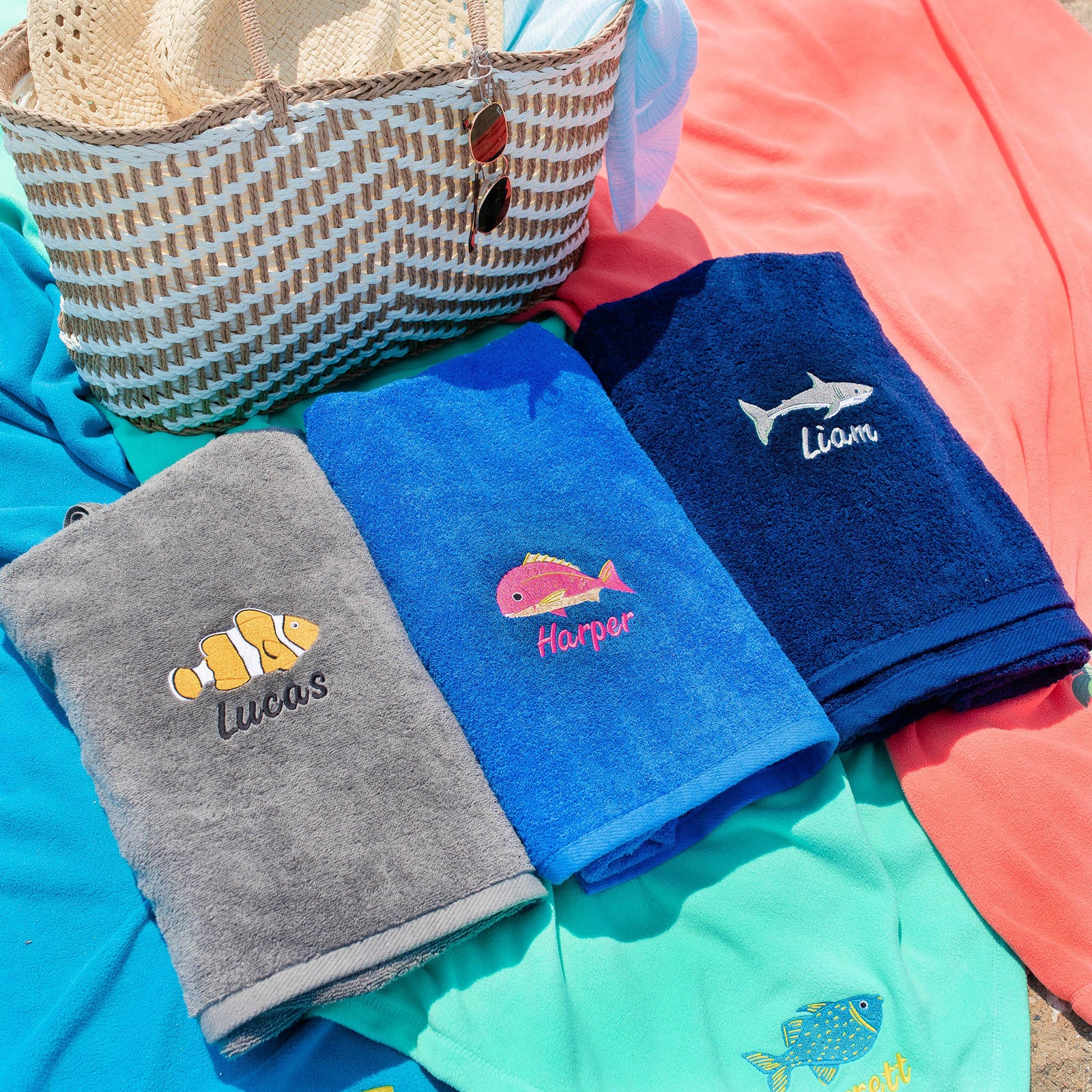 American Blanket Company - 100% Cotton Towels Beach & Pool  -Embroidered cotton pool towels showing multiple fish designs with names embroidered.