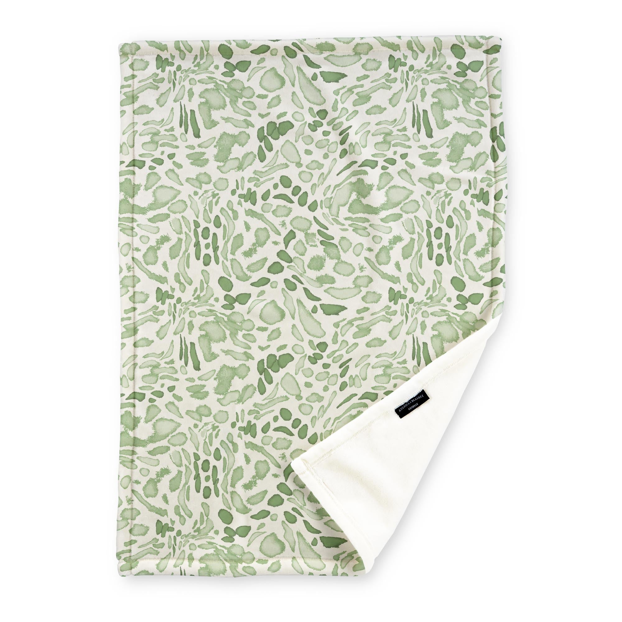 American Blanket Company - Luster Loft Fleece Blankets - Printed Fashion Fleece Throw Blankets - a Fleece blanket with a light green Leopard pattern on a white background.