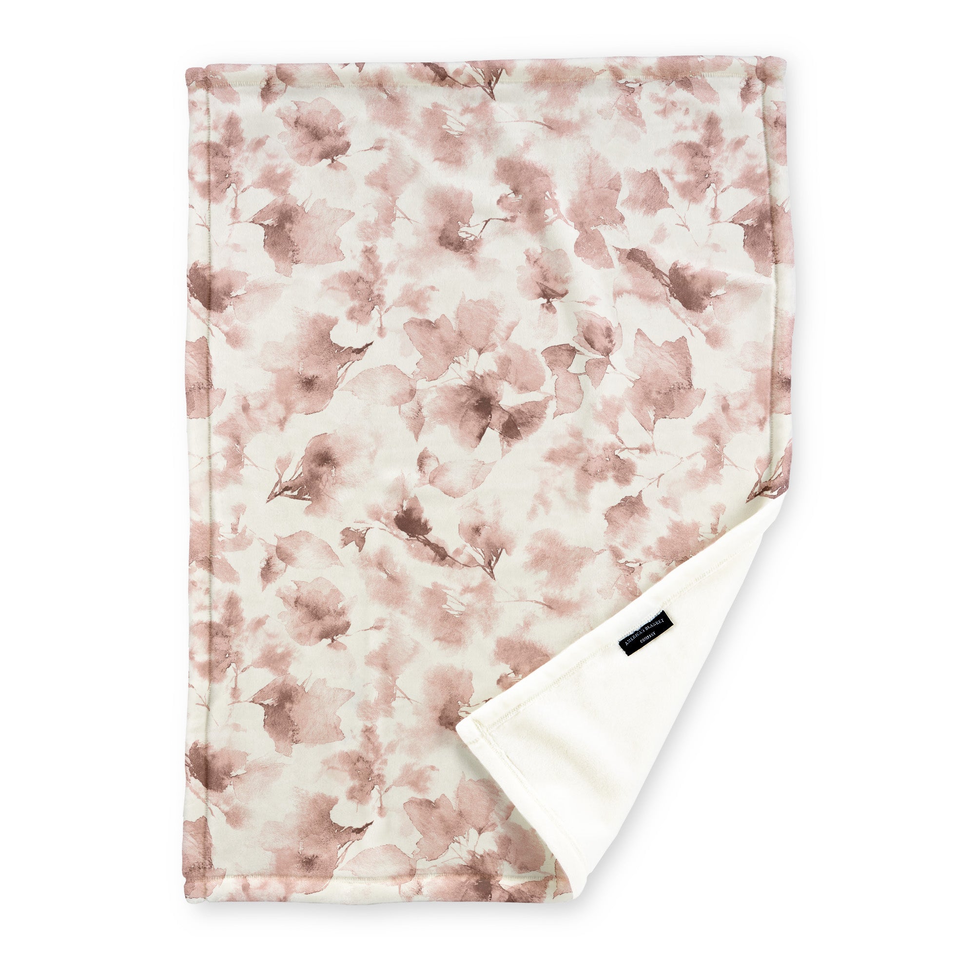 American Blanket Company - Luster Loft Fleece Blanket - Floral Printed Blankets Throws - a fleece blanket with abstract floral pattern in a range of pinks on a white background.