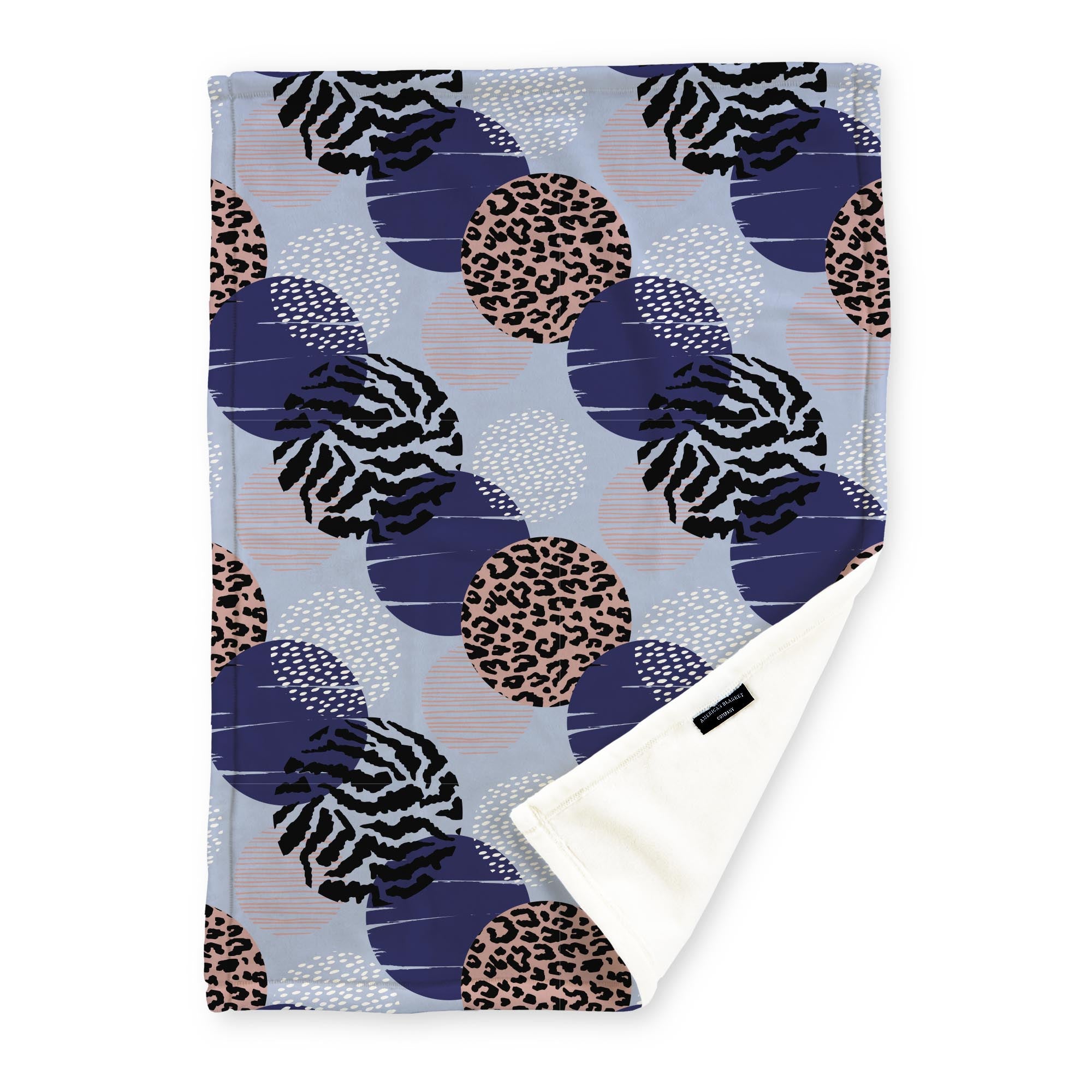 American Blanket Company - Luster Loft Fleece Blankets - Printed Fashion Fleece Throw Blankets - a Fleece blanket with a multicolored abstract circle pattern with navy, white, pink, and black on a light blue background.