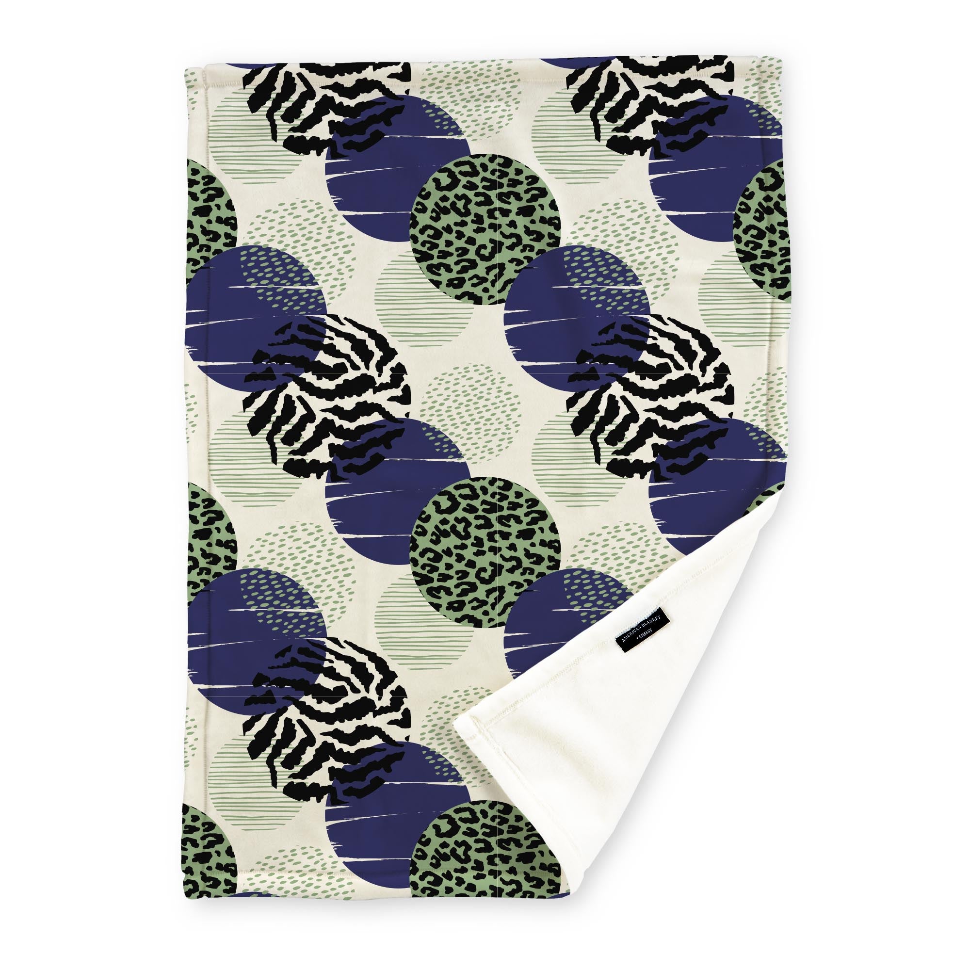 American Blanket Company - Luster Loft Fleece Blankets - Printed Fashion Fleece Throw Blankets - a Fleece blanket with a multicolored abstract circle pattern with green, blue and black on a cream background.