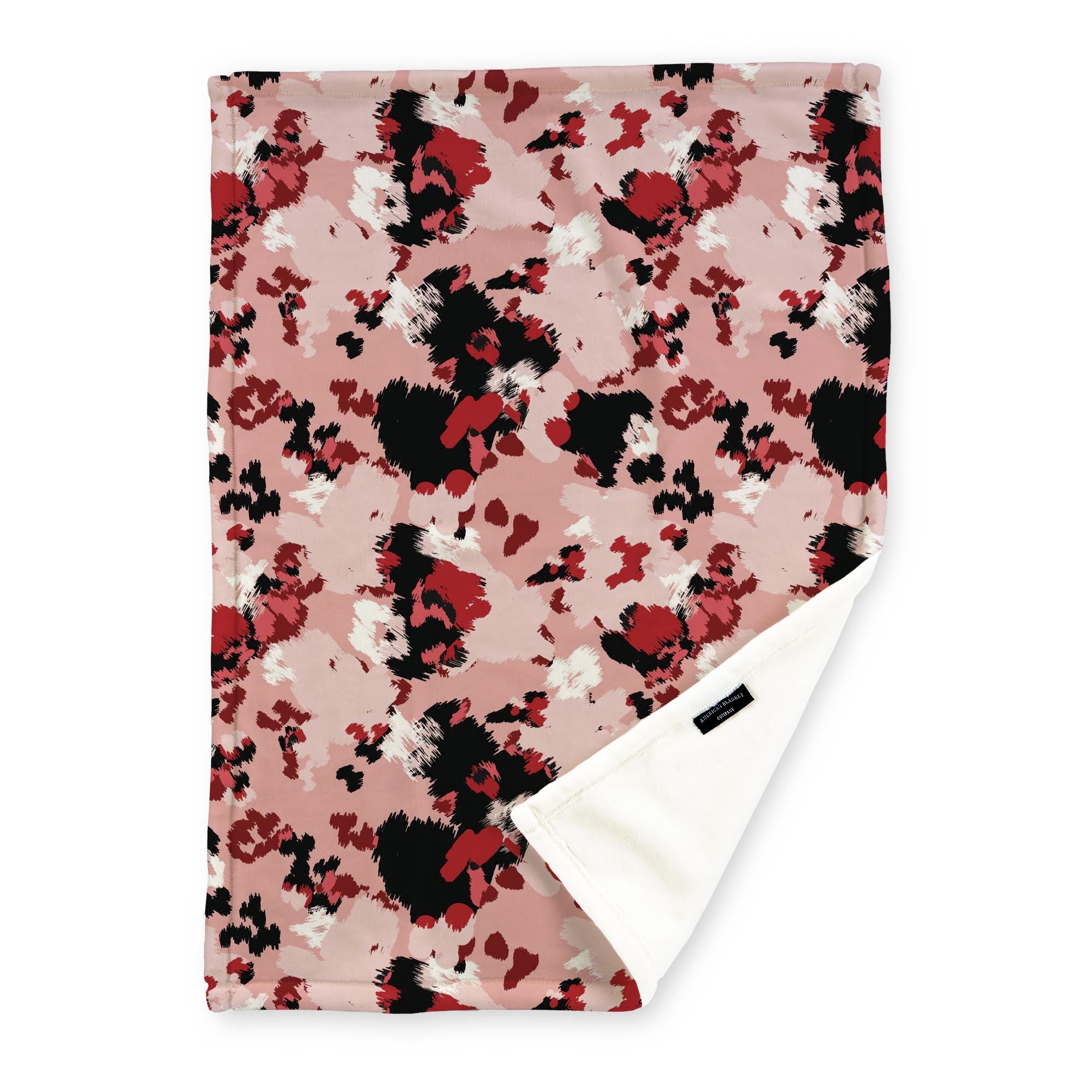 American Blanket Company - Luster Loft Fleece Blankets - Printed Fashion Fleece Throw Blankets - a Fleece blanket with a multicolored red abstract camouflage pattern on a pink background.