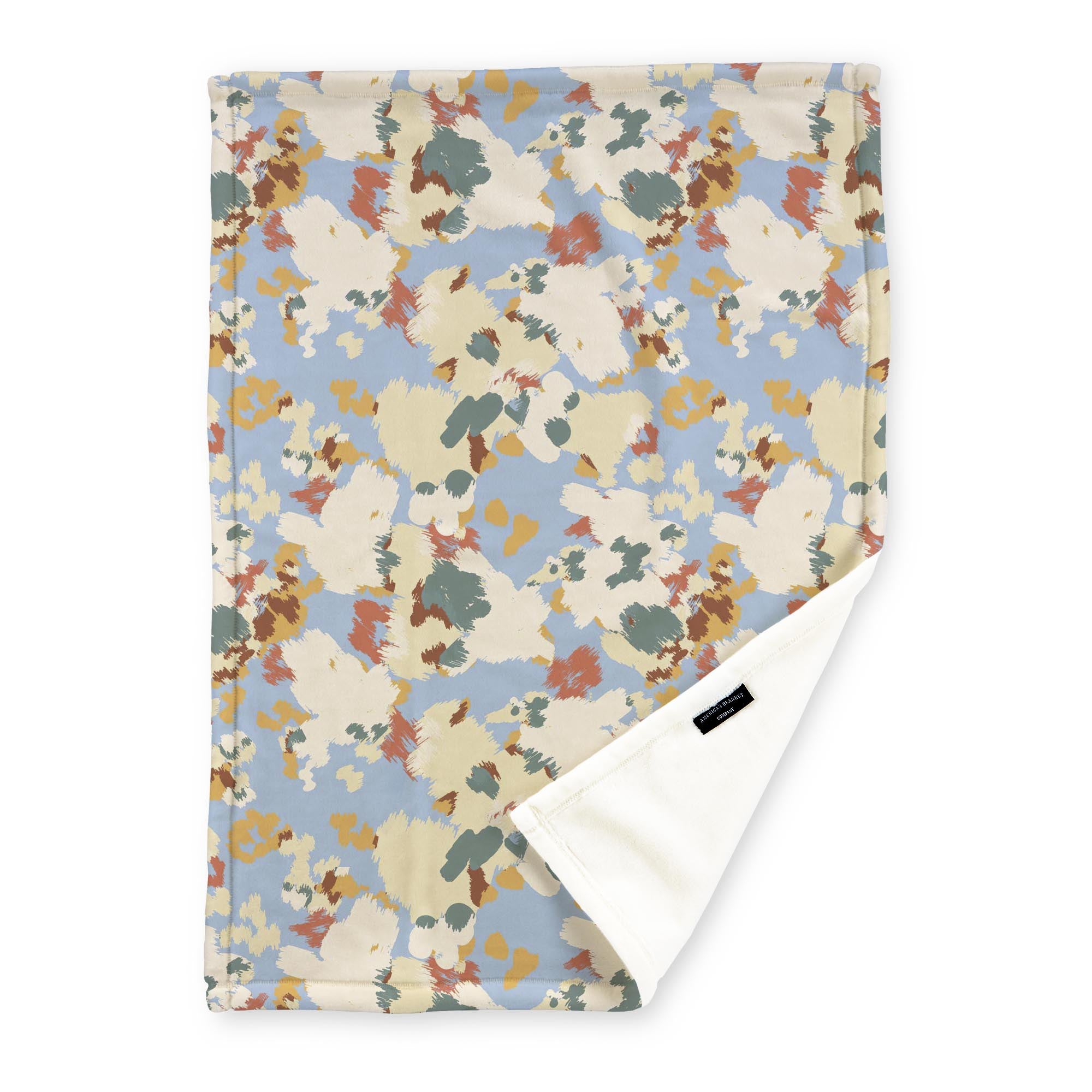American Blanket Company - Luster Loft Fleece Blankets - Printed Fashion Fleece Throw Blankets - a Fleece blanket with a multicolored abstract camouflage pattern on a  light blue background.